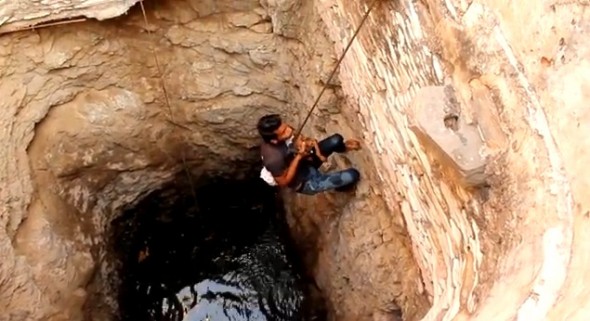 6.18.14 - Indian Community Rescues Drowning Puppy Moments from Death2