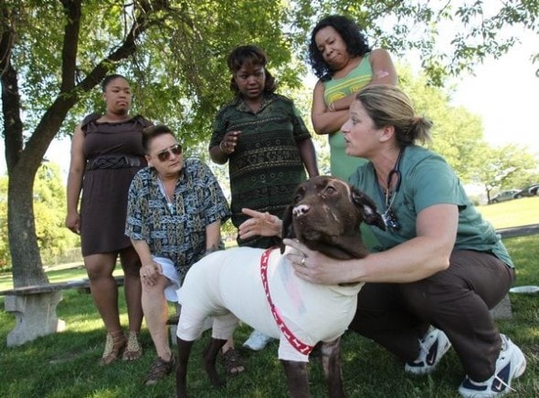 Dr. Helene Chevalier, who cared for Rocsi after a house fire left her badly burned, gives care instructions to, from left, Paris Reeves, Kim Sieber, Tonya Jackson and Afia Lott. (Photo credit to Sharon Cantillon of The Buffalo News)