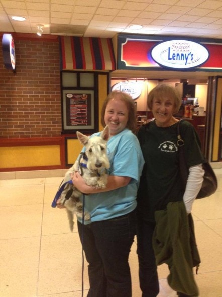 Suzie Brooks (L) and Cheri Davis (R) prepare to take Doogie home.