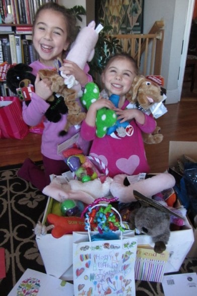 Isabella and Lucinda with the "paws party" donations. Photo Credit: Lynne Allen