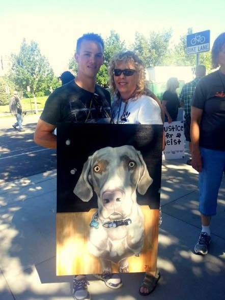 Sean Kendall holds a poster of Geist.