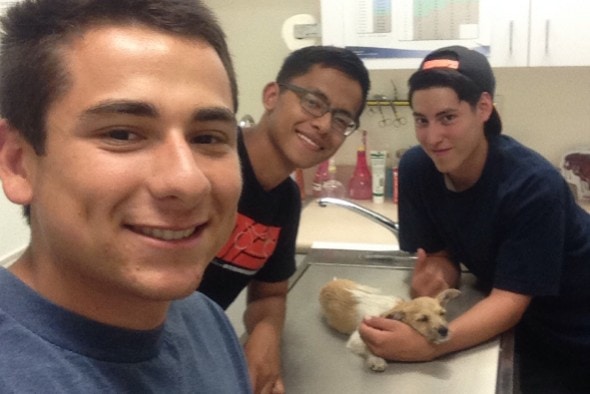 Ninja with his rescuers at the vet. Photo Credit: Isaac Gonzales