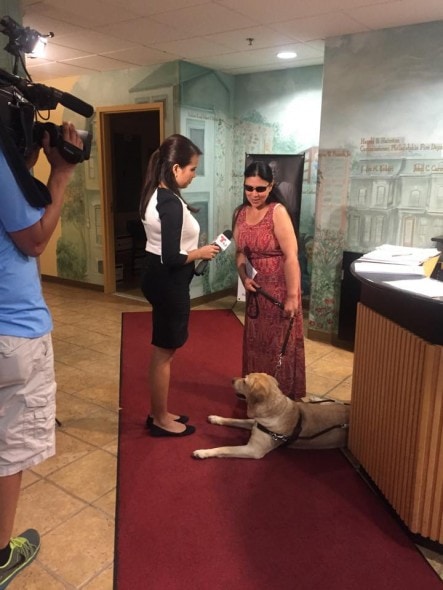 Yolanda and her owner doing TV interviews. Photo Credit: Red Paw Emergency Relief Team