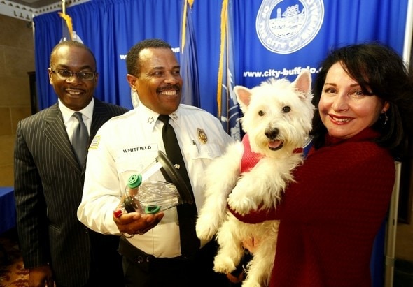 From left, Mayor Byron Brown, Fire Commissioner Garnell W. Whitfield, Minnie, and Ann Louise Ciminelli.