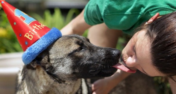 Zuba gives her foster mom a kiss. Having a birthday party was one of 54 items on her Bucket List. Photo: Vicki Cronis-Nohe/The Virginian-Pilot ----------------------------------- 