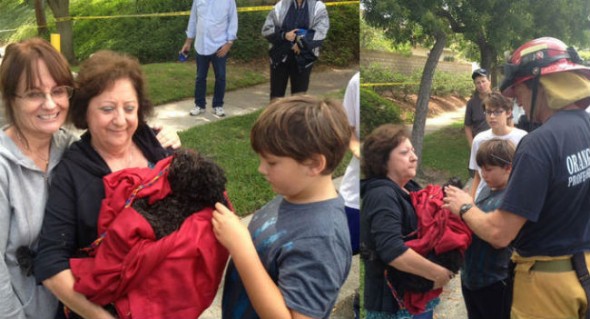 Sparky post-rescue, safe in the arms of his family. (Photo: OCFD) 