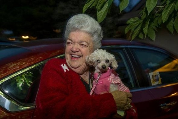 Sally Butters snuggles little Gigi, the toy poodle who went missing nine years ago. Photo: SacBee 